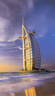 A Modern City In A Timeless Desert With An Azure Blue Sea