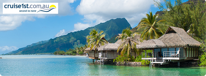 container and thatched roof houses by the beach