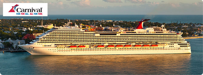 Carnival Magic cruise ship sailing at sunset