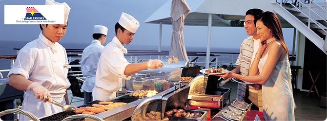 Chefs serving guests in the ship