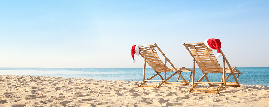 Santa hats on a sunny beach