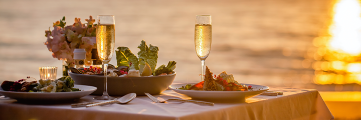 Champagne and dinner at sea during sunset